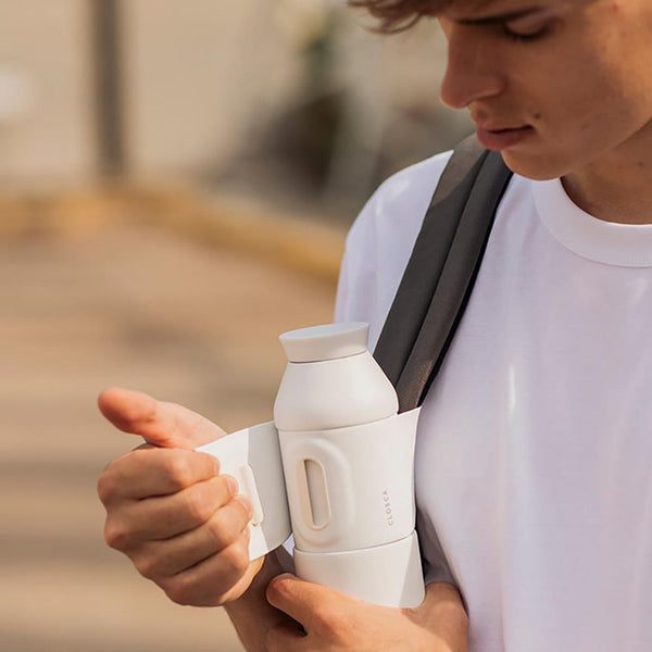 20oz Reusable thermos bottle in white. Patented silicone flap making it hands free with a soft touch.