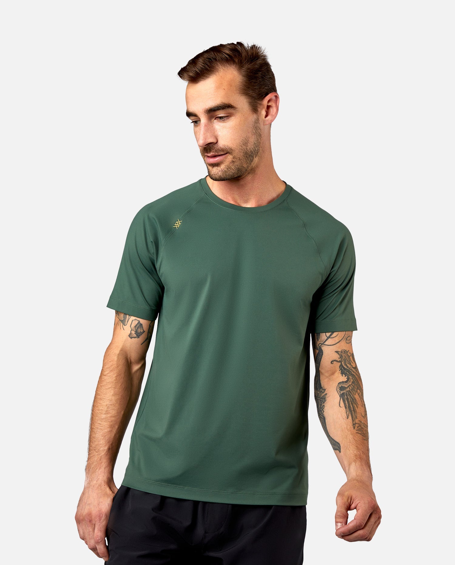 Men's performance crewneck t-shirt in color evergreen. Moisture-wicking shirt.
