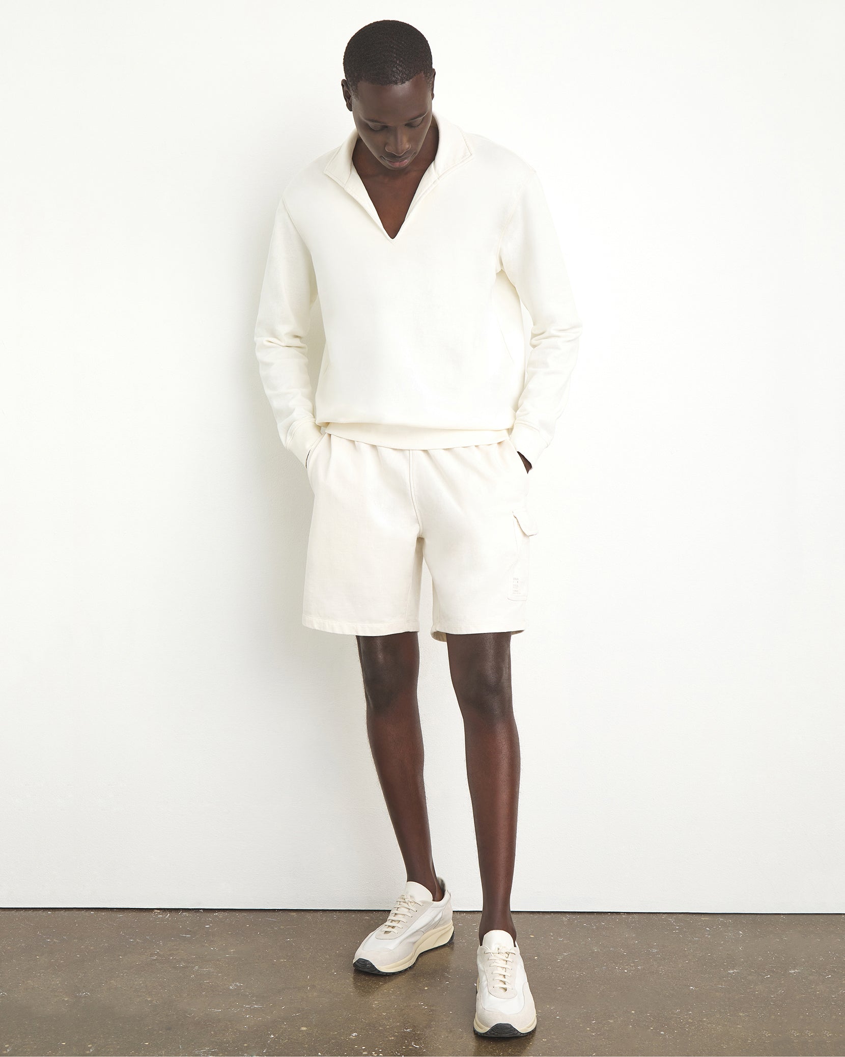 Men's 8 inch cargo short in color off-white with a relaxed fit in jersey cotton.