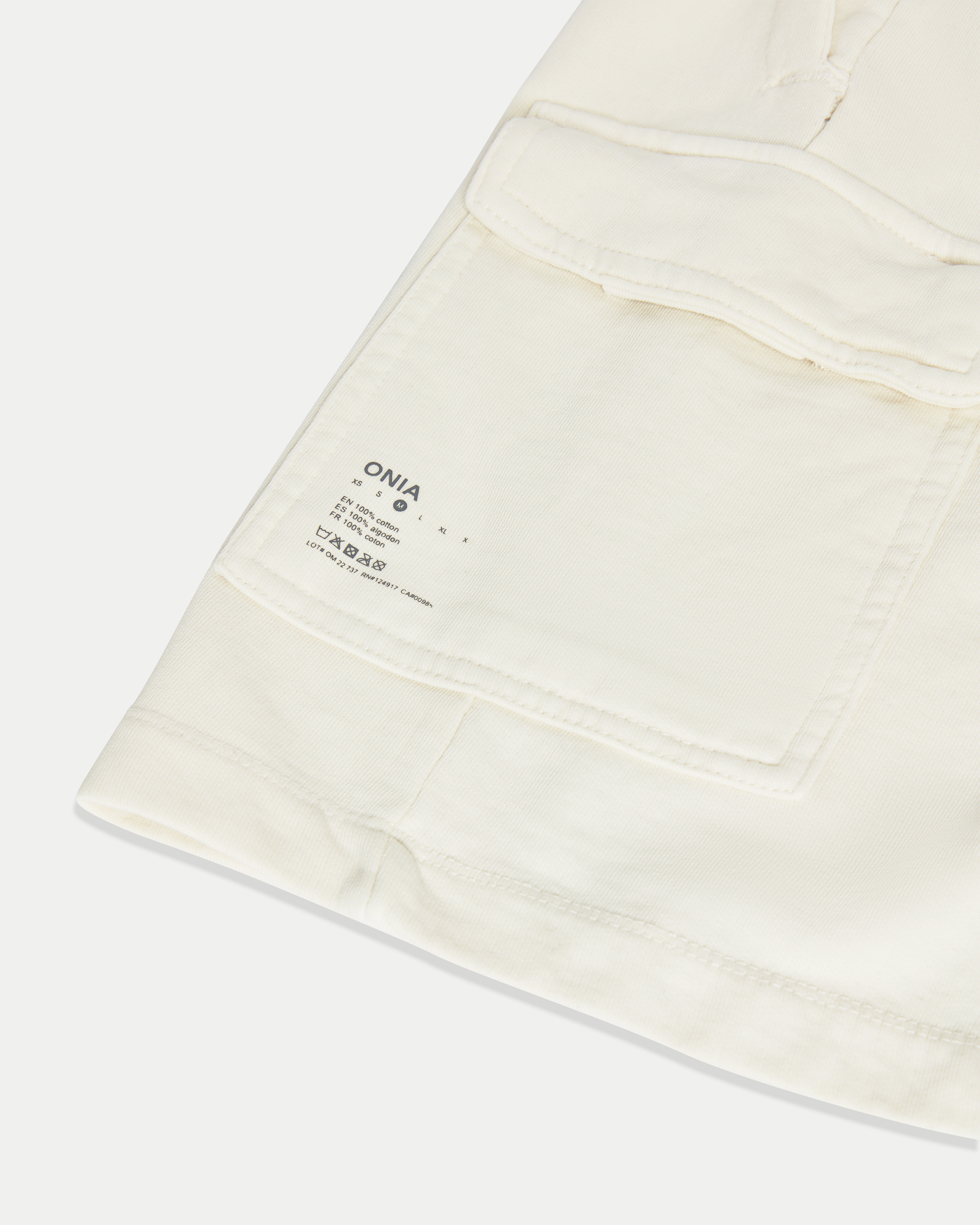 Men's 8 inch cargo short in color off-white with a relaxed fit in jersey cotton.