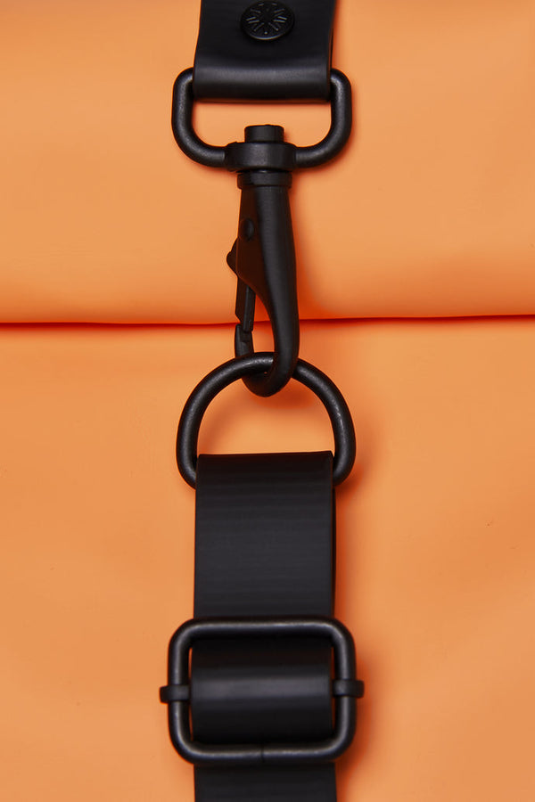 Minimalistic, waterproof backpack with a secure rolltop closure in neon orange with black details