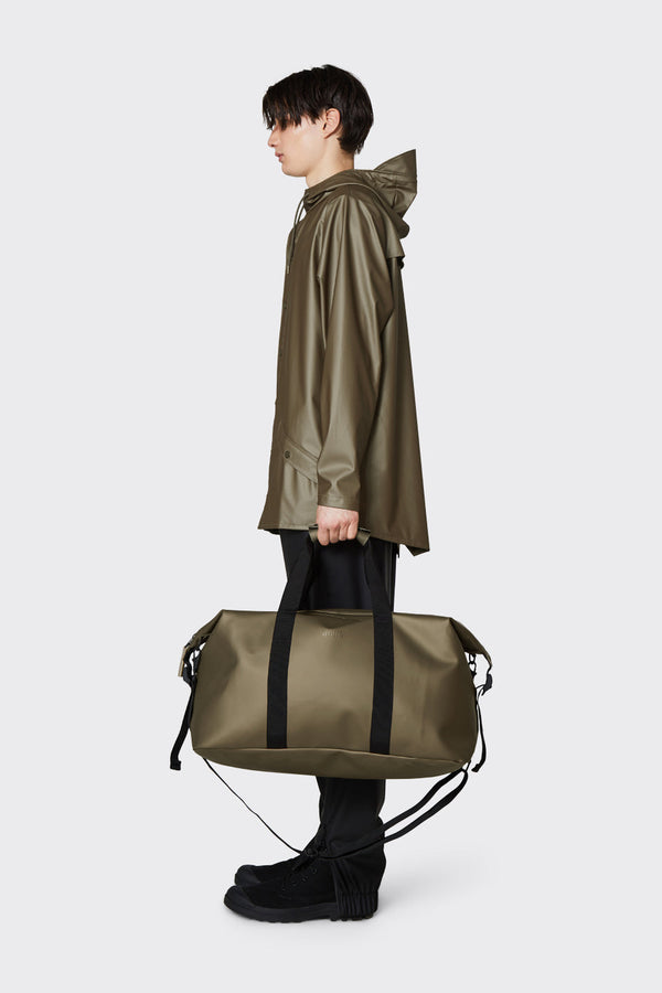 Waterproof, minimalistic duffel bag with a single main compartment in metallic bronze