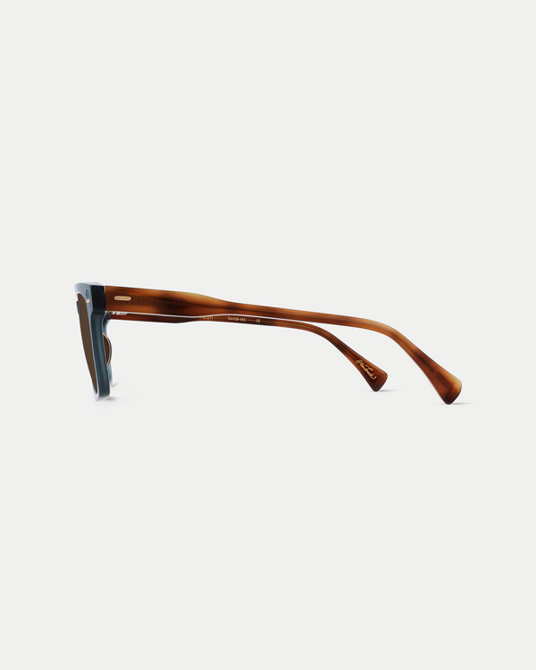 Men's polarized sunglasses with a flat brow, wide fit, and strong angles in cirus blue with brown lens.