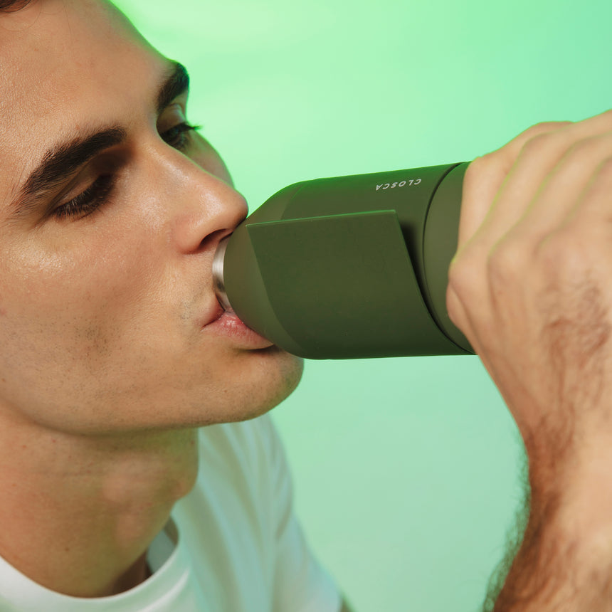 20oz Reusable thermos bottle in hunter green. Patented silicone flap making it hands free with a soft touch.