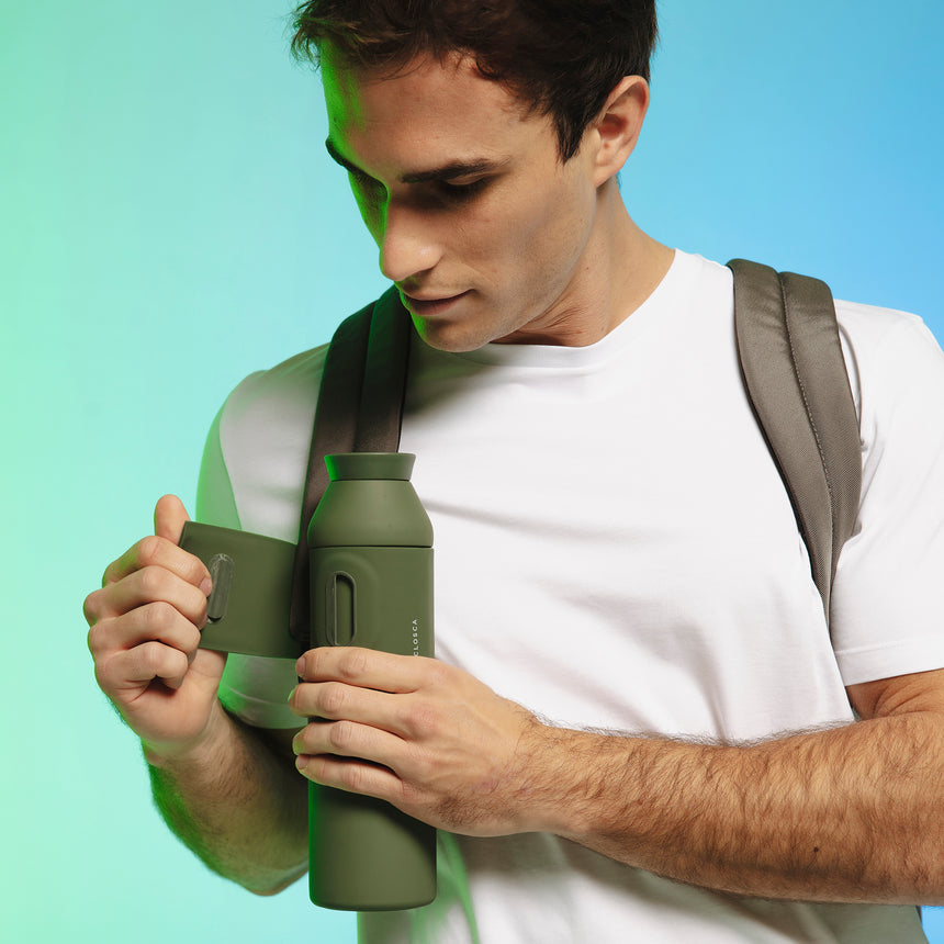 20oz Reusable thermos bottle in hunter green. Patented silicone flap making it hands free with a soft touch.