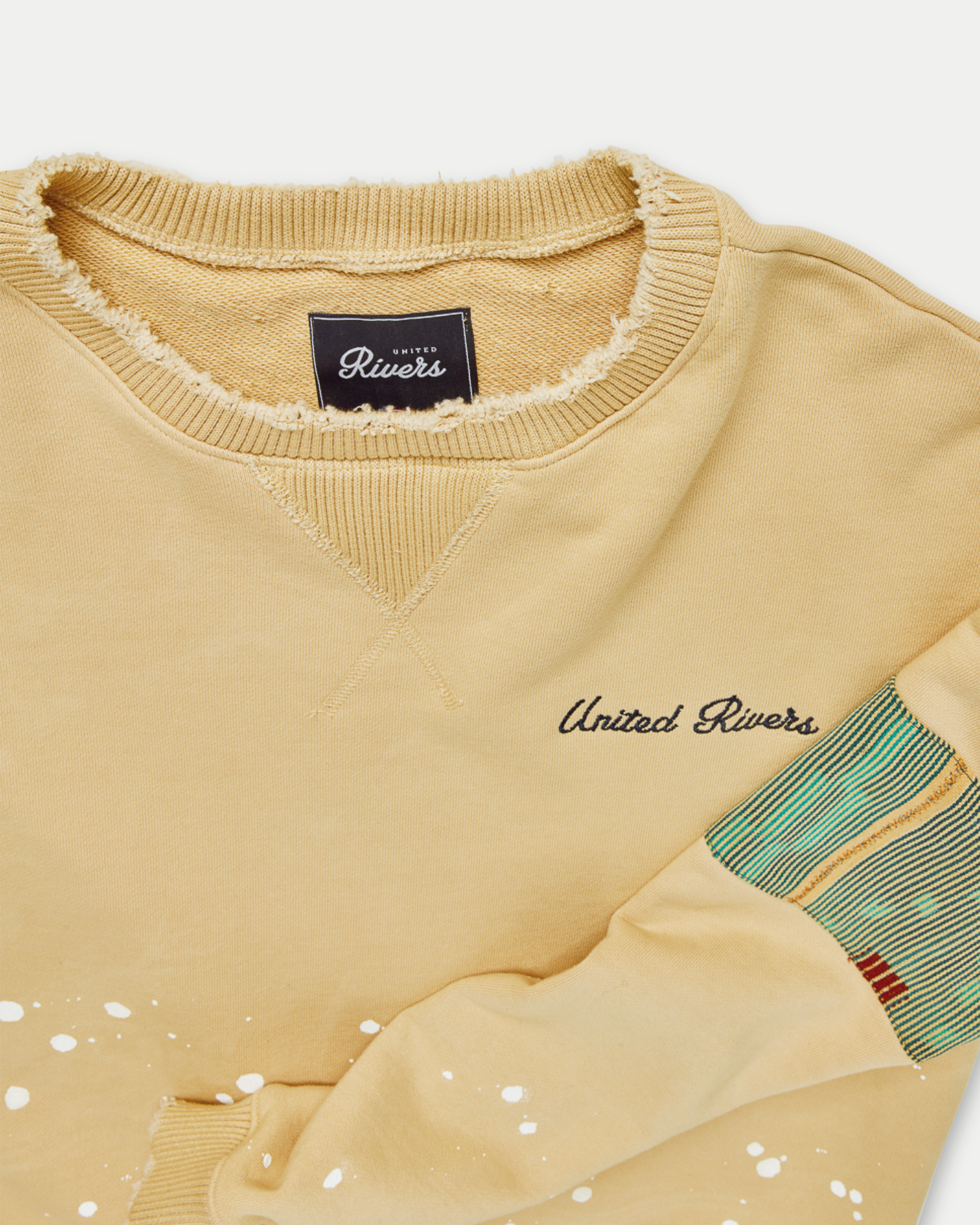 Men's oversized crewneck sweater in beige with artistic features in 100% cotton.
