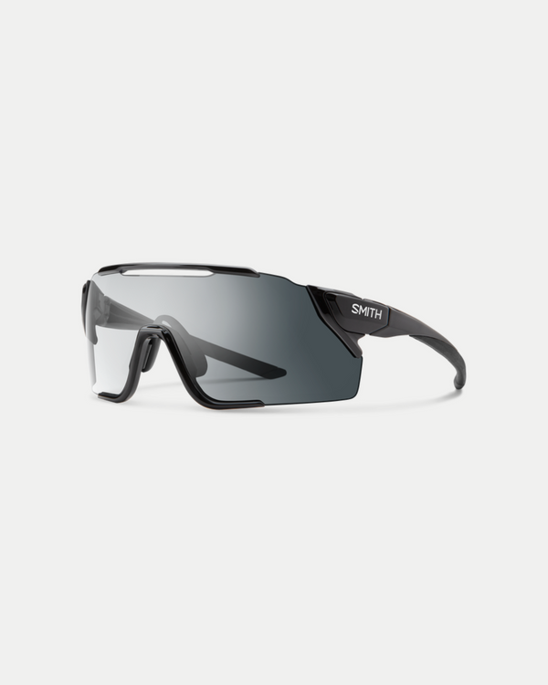 Men's sleek performance sunglasses with maximum coverage and resistant materials in black with a transforming photochromic gray lens 