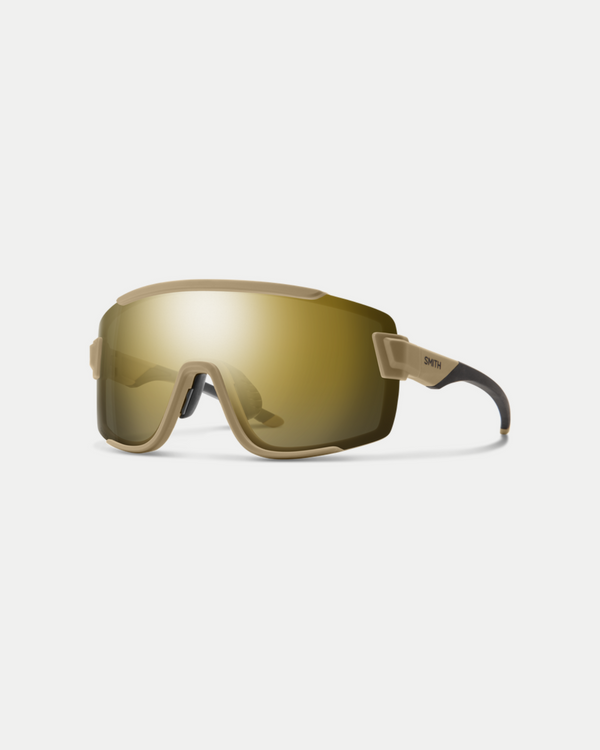 Men's active sunglasses that offer protection and have the coverage of goggles. An easy-to-wear style with a no slip nose piece in metallic gold/black.