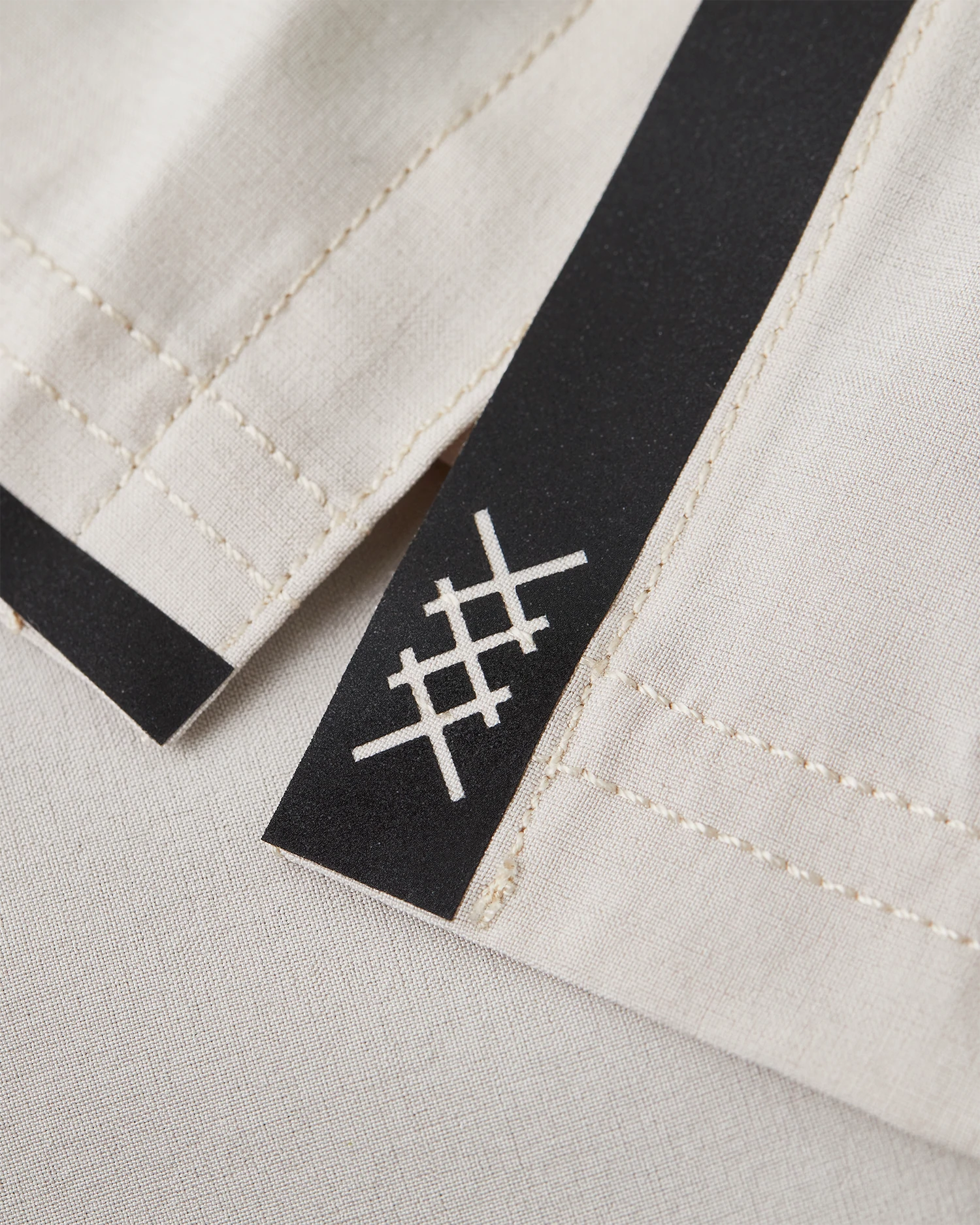 Men's 6 inch training short in color nude with black lining.