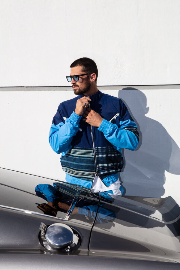 Men's slim fit tracksuit jacket with mixed materials in multi-blue.