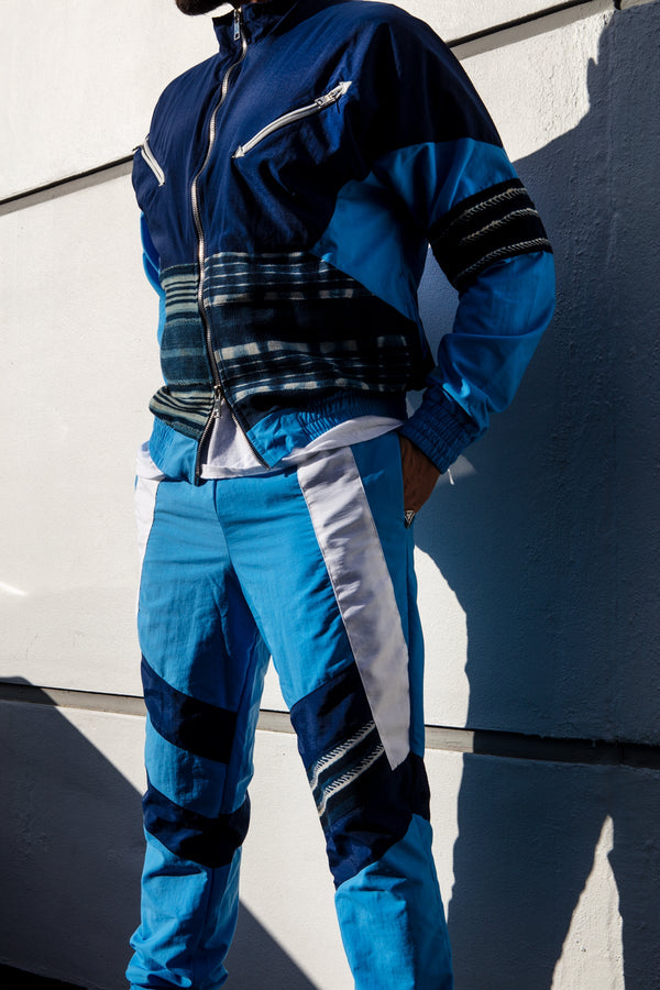 Men's slim fit tracksuit jacket with mixed materials in multi-blue.